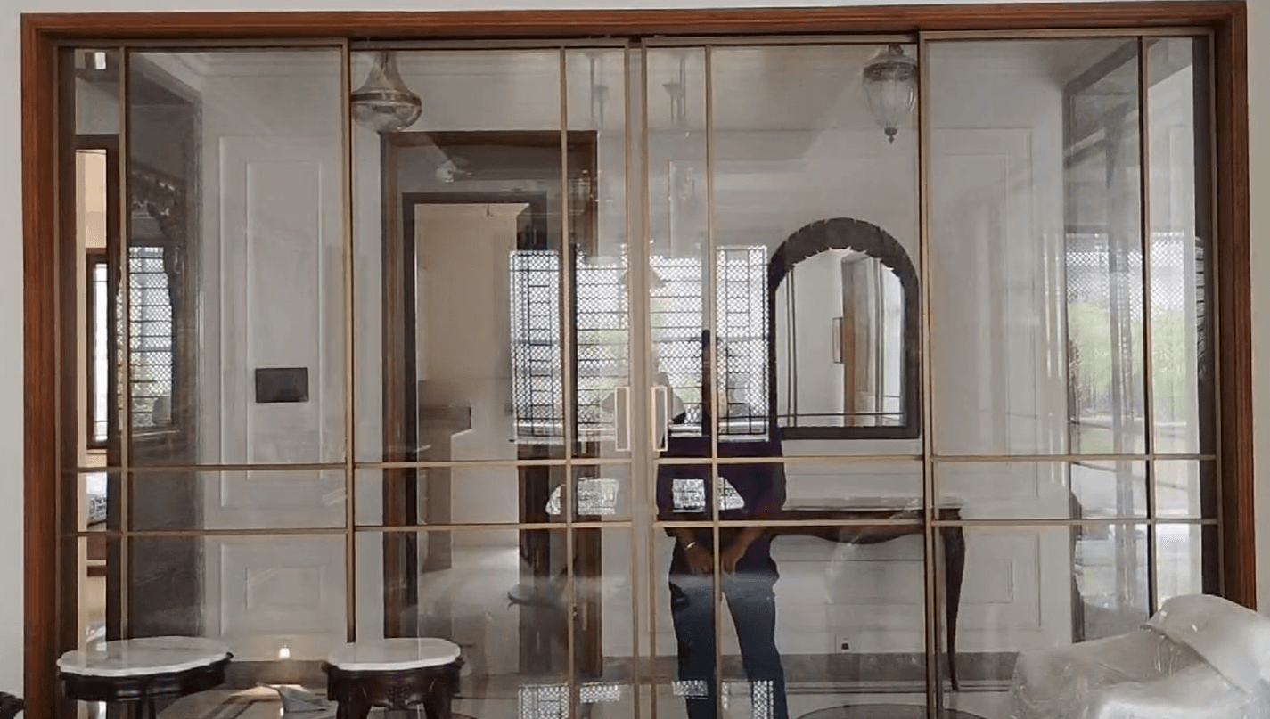 Synchro Sliding in Brush Gold by Cube Partitions for premium glass partition projects